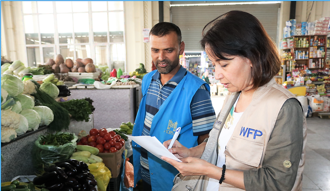 A woman conducts market research in the food market